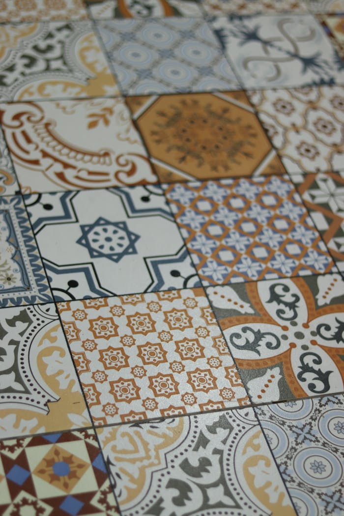 Vibrantly patterned vintage ceramic tiles forming a geometric design.